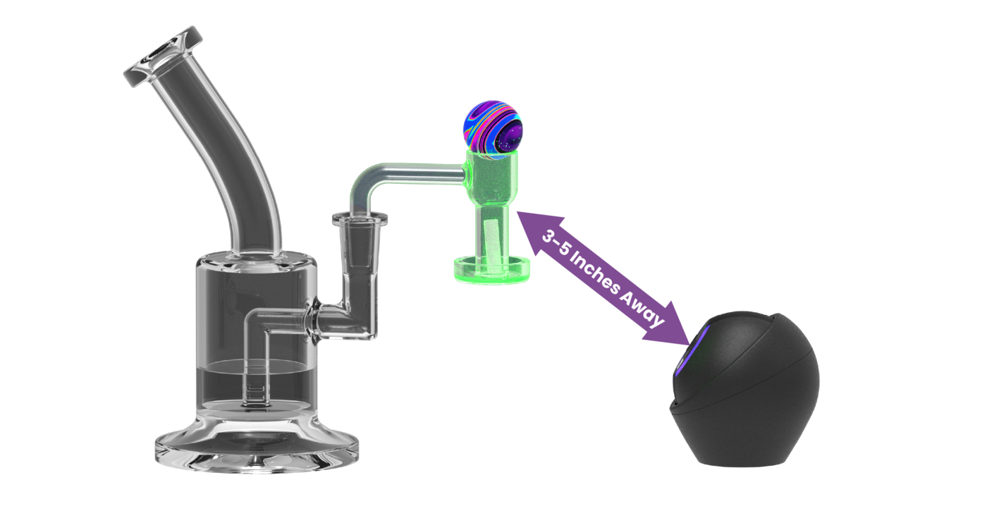 A Dab Rite GO aimed at a Rig with Banger illuminated by the Green guide light - range indicated as 3-5 inches